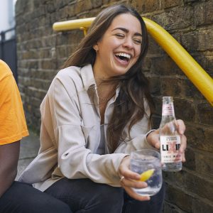 lady drinking and laughing